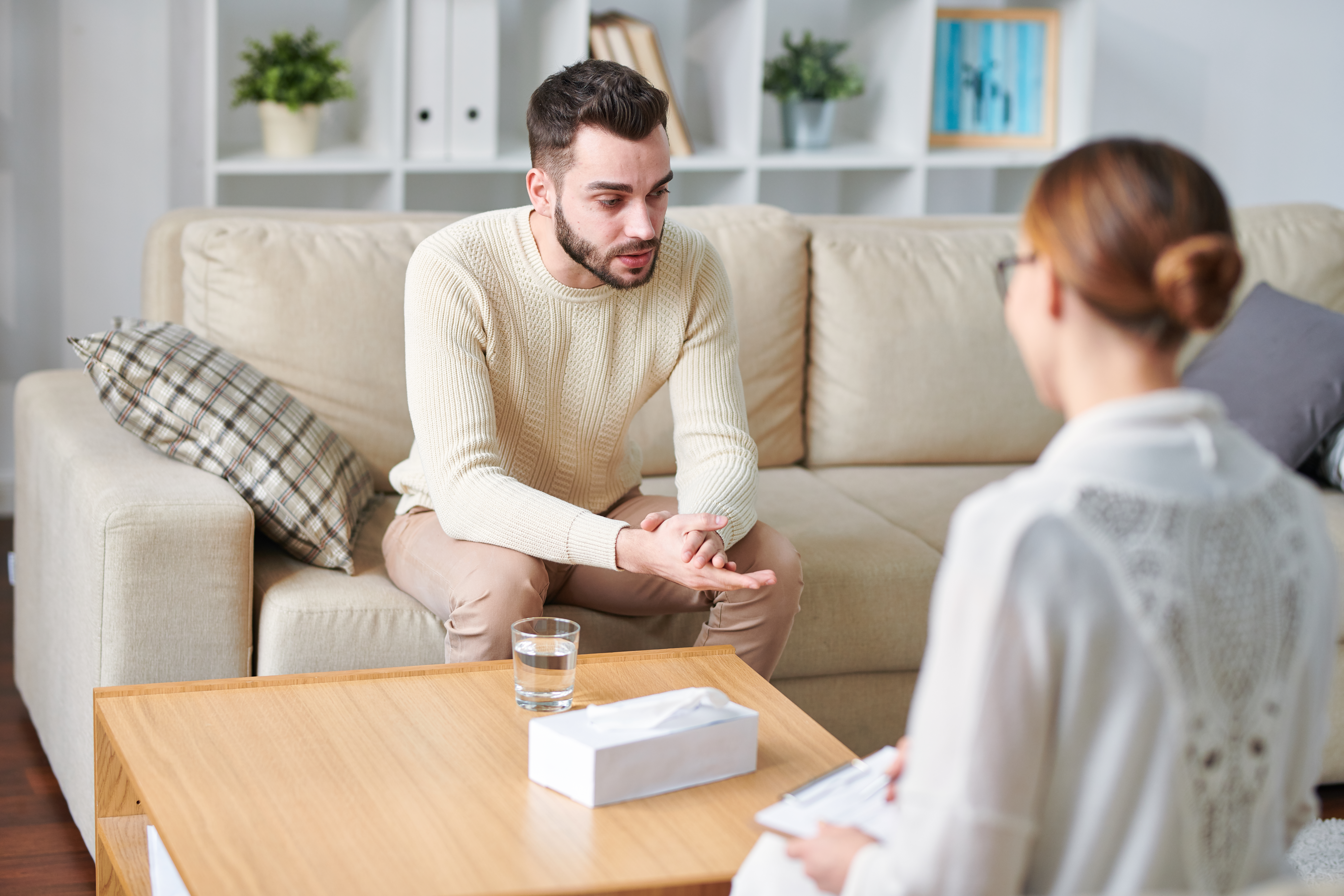 Young,Stressed,Man,In,Casualwear,Sitting,On,Couch,During,Individual